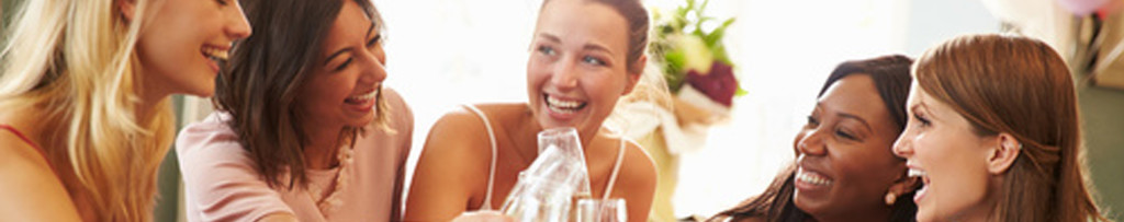 Laughing woman talking and texting on the phone isolated on a white background